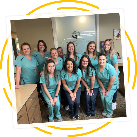 Our orthodontics team smiles after seeing our orthodontic patients for the day