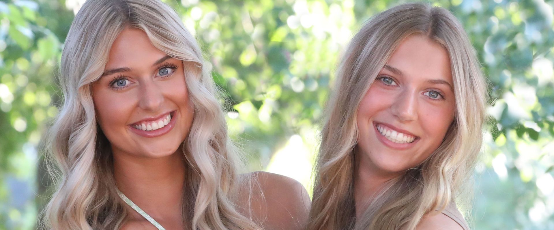 adult sisters smile and debate veneers vs invisalign