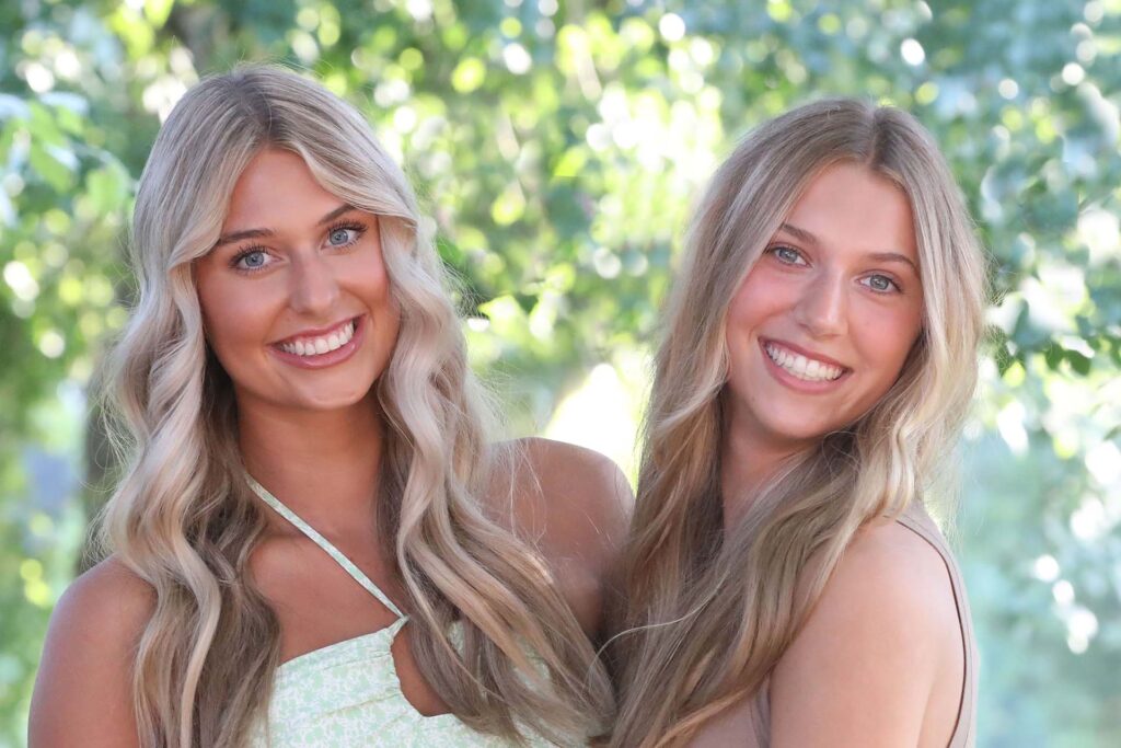 sisters smiling after corrective jaw surgery