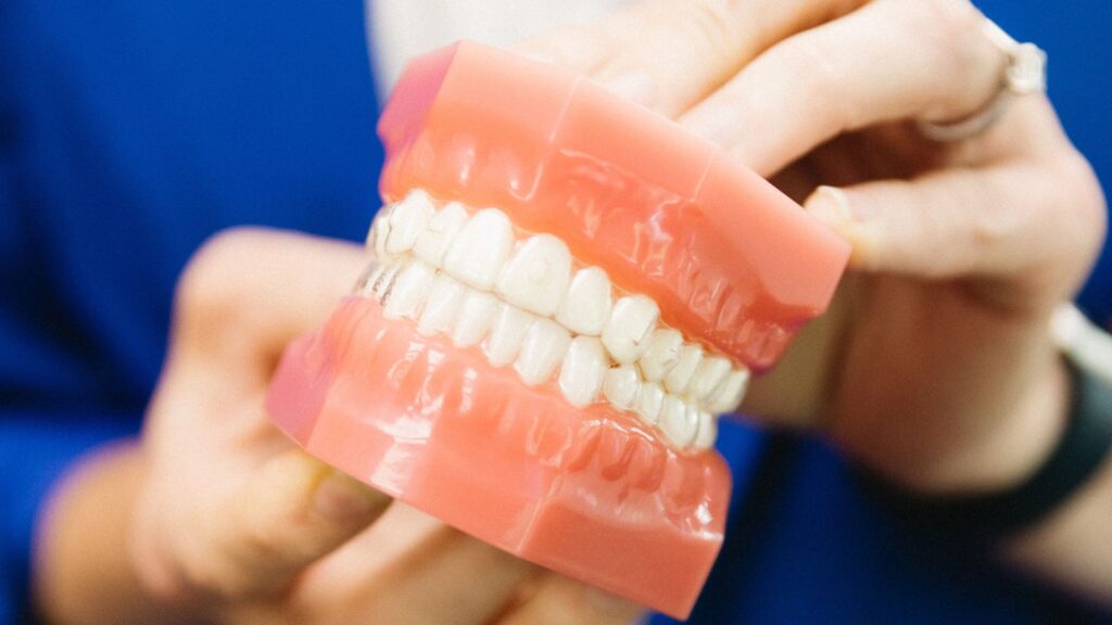 orthodontist explaining Orthodontic Health Month