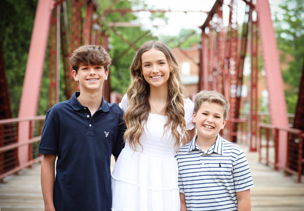 siblings all smile after orthodontic treatment