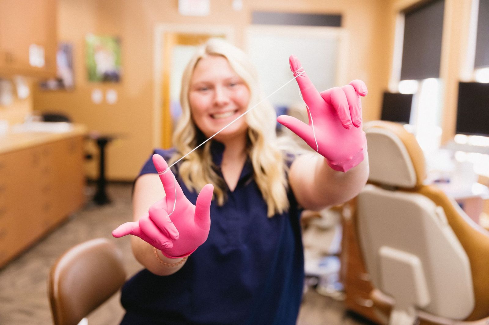 assistant holds floss explains braces with cavities answers