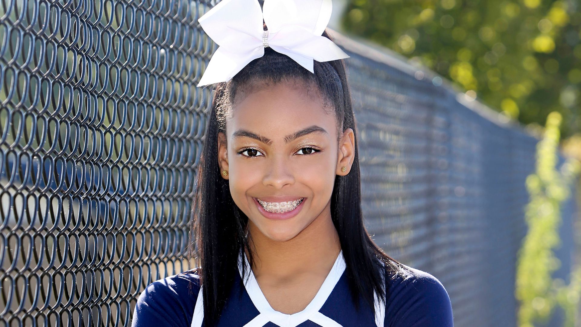 teen wearing mouthguard for braces