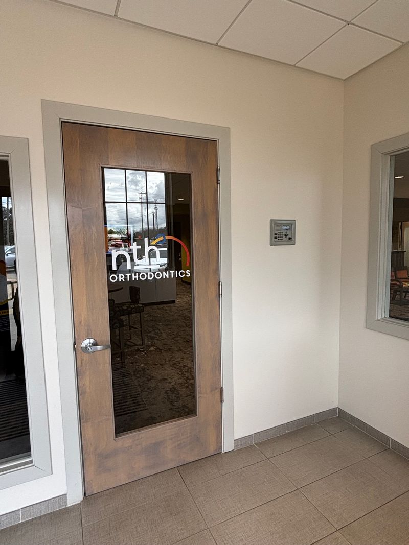 Nth Degree Orthodontics office entrance in Gaffney, SC with logo on door.