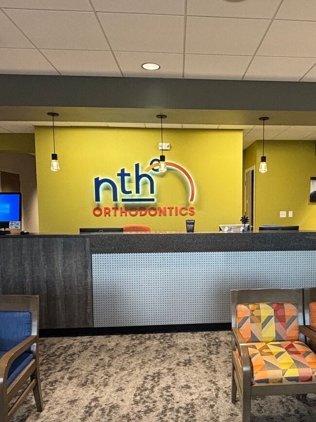 Nth Degree Orthodontics Gaffney office reception area with branded wall signage.