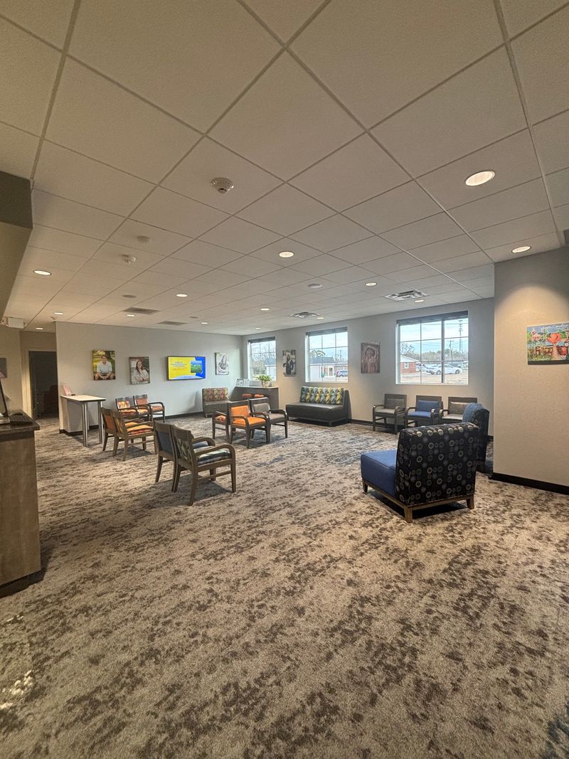 Nth Degree Orthodontics waiting area in Gaffney, SC with comfortable seating and patient photos.